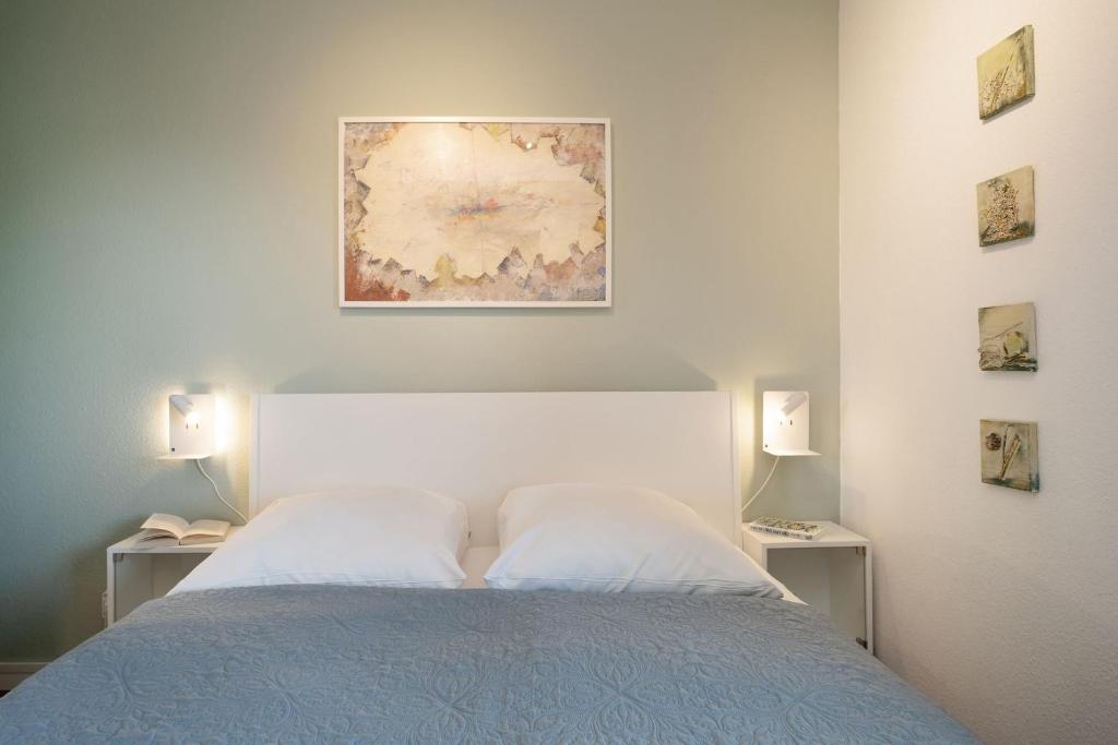 Postel nebo postele na pokoji v ubytování Seeschlösschen Wohnung 524
