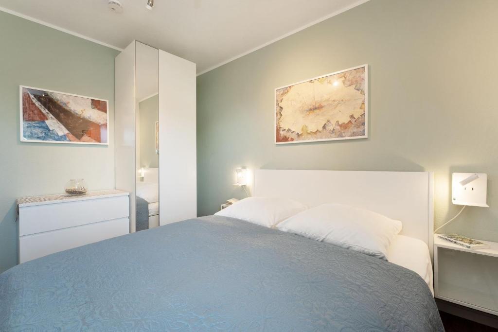 Postel nebo postele na pokoji v ubytování Seeschlösschen Wohnung 524