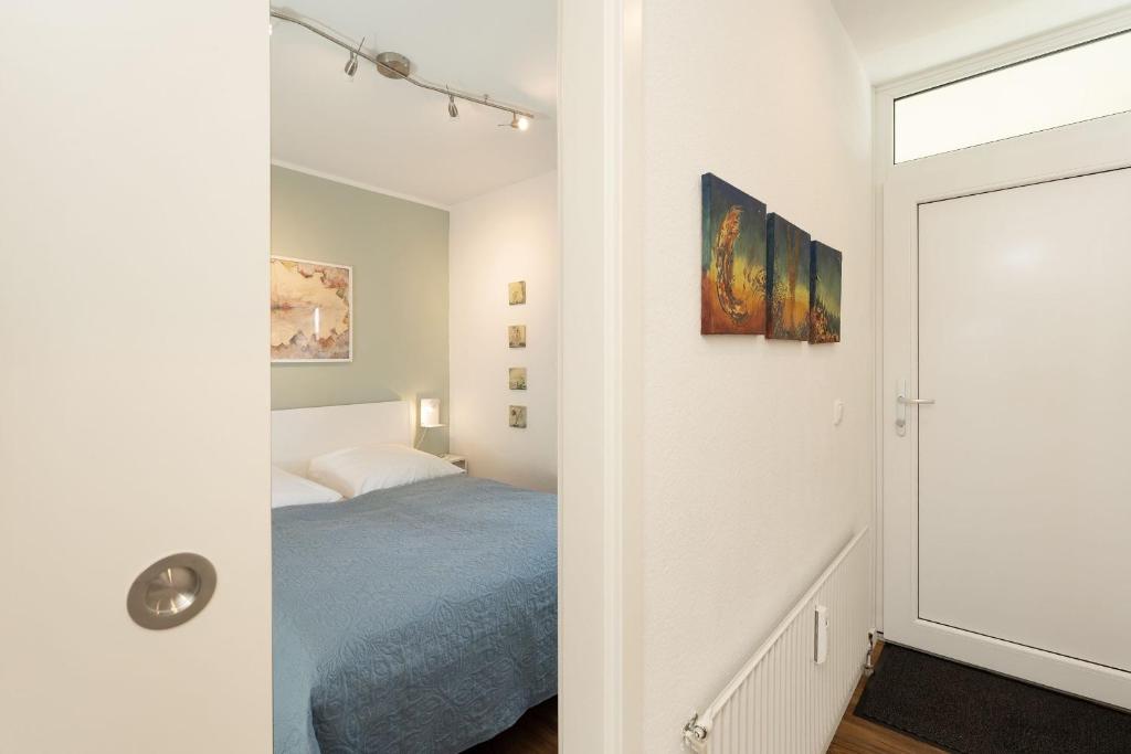 Postel nebo postele na pokoji v ubytování Seeschlösschen Wohnung 524
