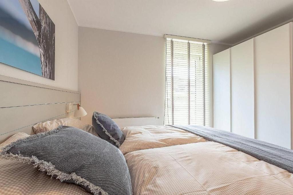 Postel nebo postele na pokoji v ubytování Sonne und Meer Wohnung 2