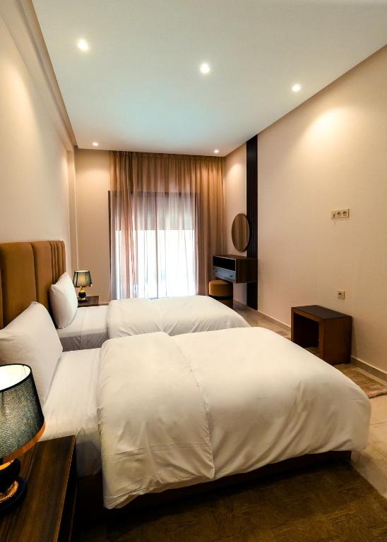 Postel nebo postele na pokoji v ubytování Medina residency