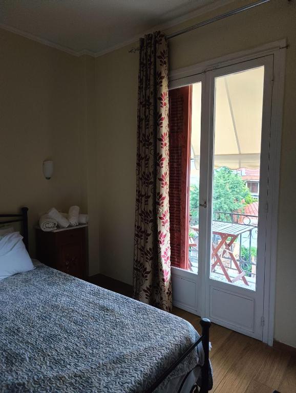Postel nebo postele na pokoji v ubytování Anesis Hotel