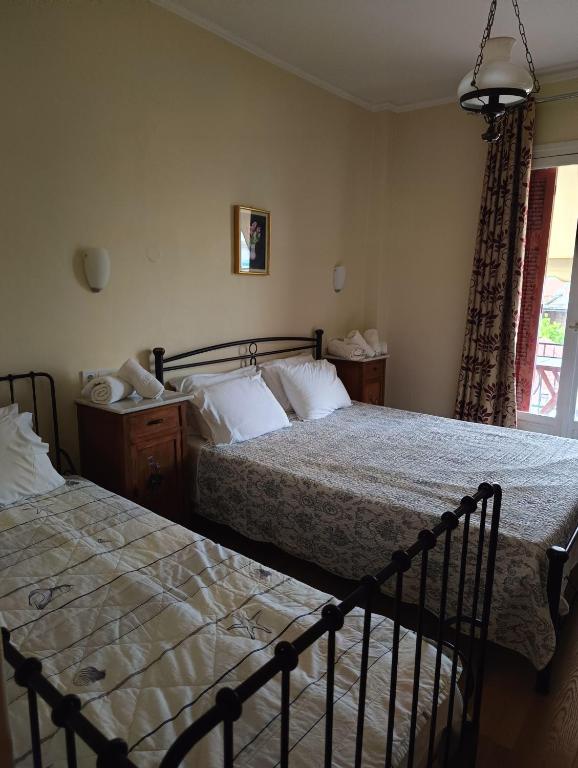 Postel nebo postele na pokoji v ubytování Anesis Hotel