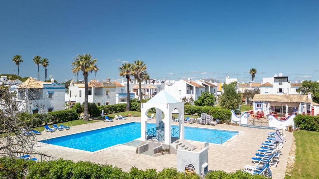 a view of the pool at a villa with a resort at Quinta Velha Oasis, Pool Resort in Cabanas de Tavira