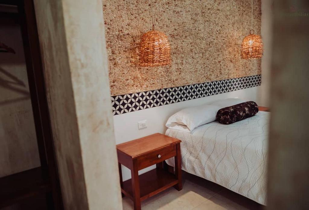 Postel nebo postele na pokoji v ubytování Hotel Boutique Bugambilias
