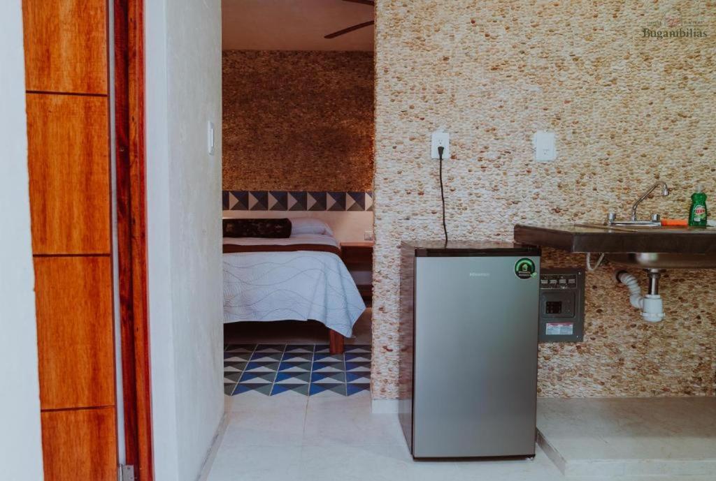Kuchyň nebo kuchyňský kout v ubytování Hotel Boutique Bugambilias