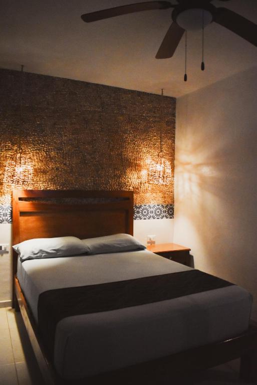 Postel nebo postele na pokoji v ubytování Hotel Boutique Bugambilias