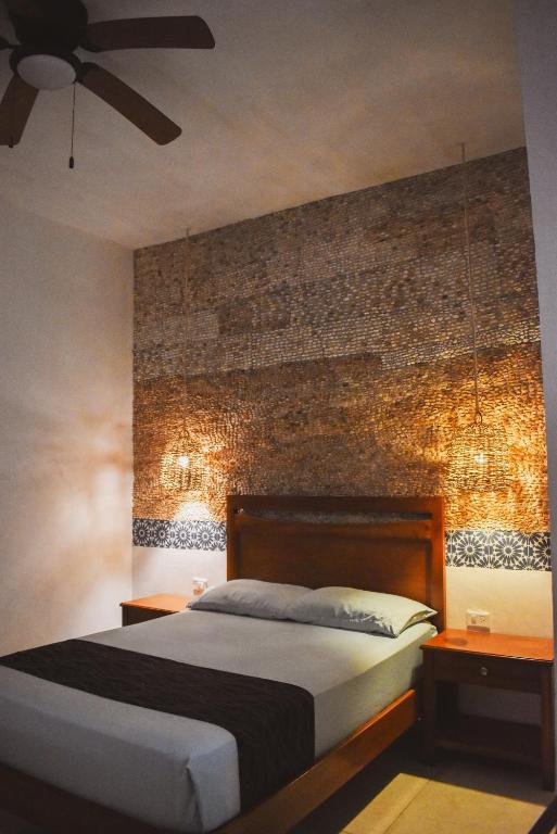 Postel nebo postele na pokoji v ubytování Hotel Boutique Bugambilias