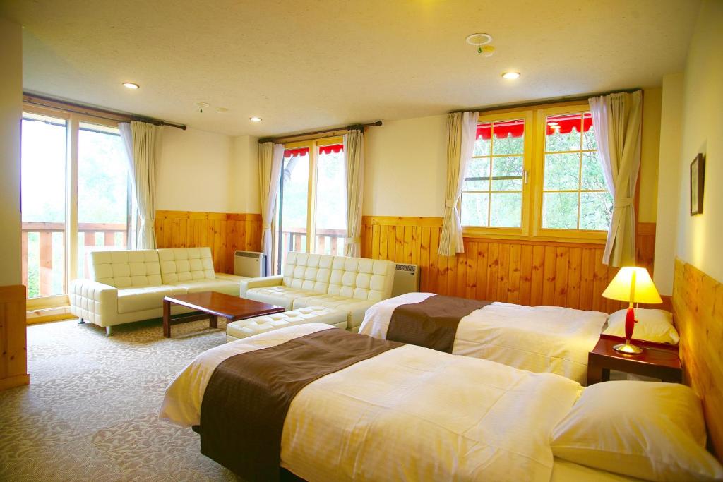 Postel nebo postele na pokoji v ubytování Hotel Andermatt