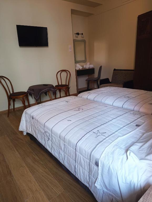 Postel nebo postele na pokoji v ubytování Anesis Hotel