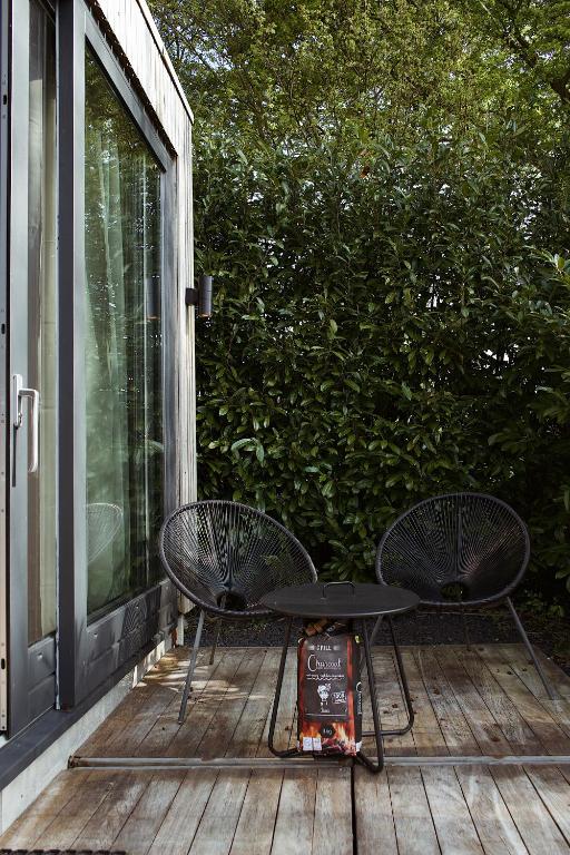Giardino di Modern Tiny House op rustig Watersportpark