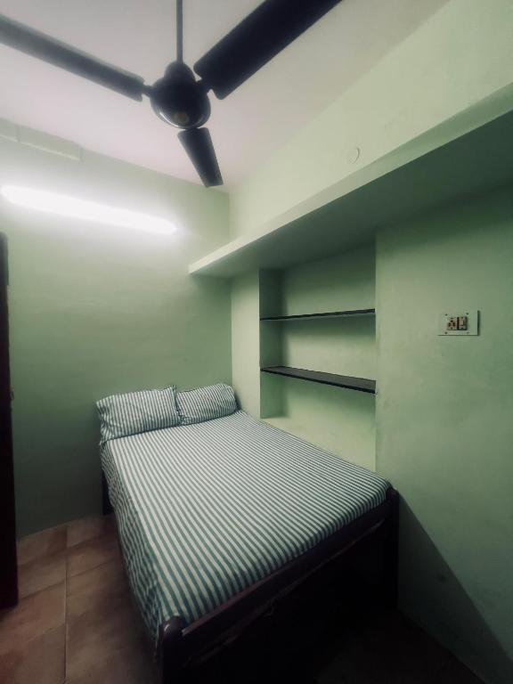 Postel nebo postele na pokoji v ubytování Smk Mukil Homestay