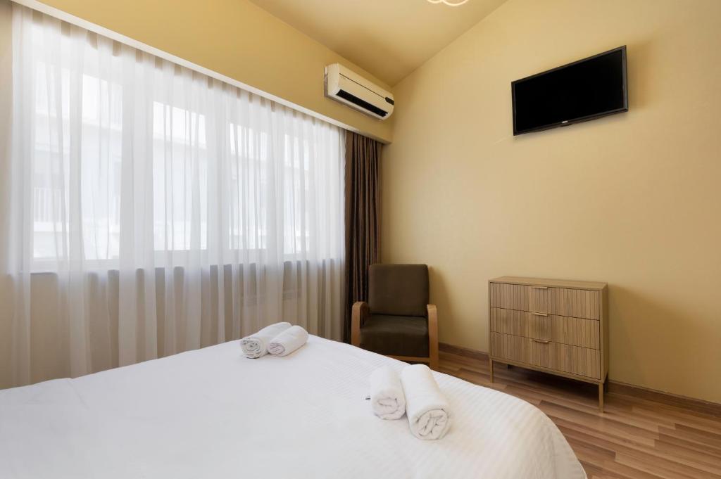 Postel nebo postele na pokoji v ubytování Acord Hotel & Balcony
