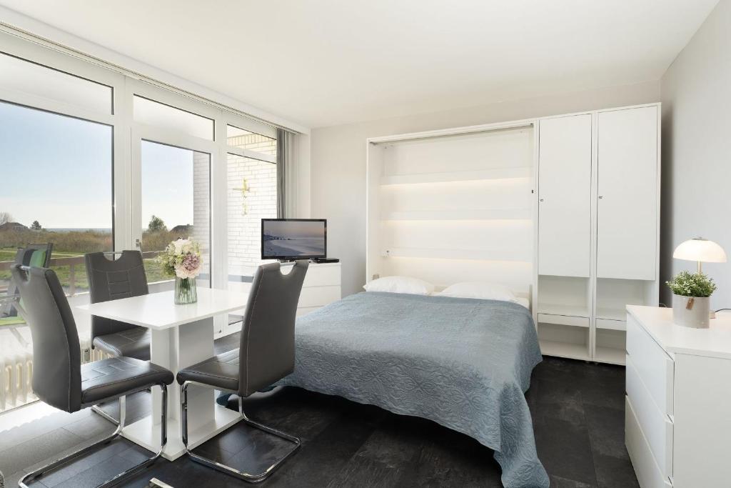 Postel nebo postele na pokoji v ubytování Baltic Wohnung 143