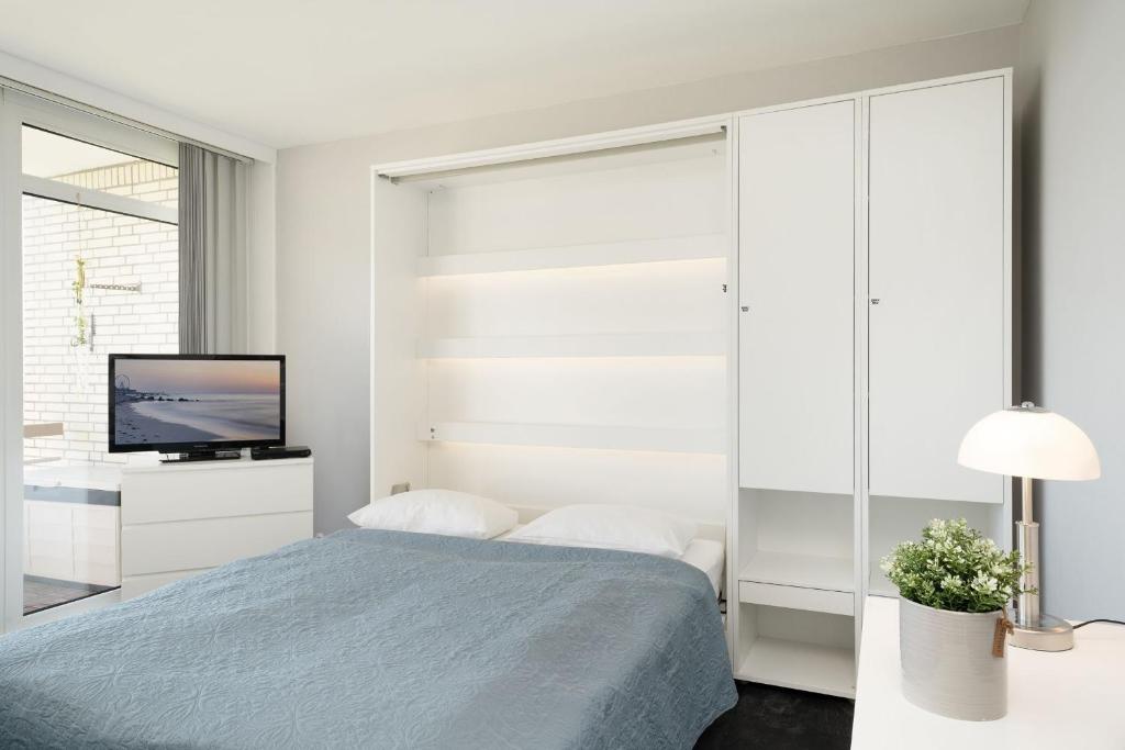 Postel nebo postele na pokoji v ubytování Baltic Wohnung 143