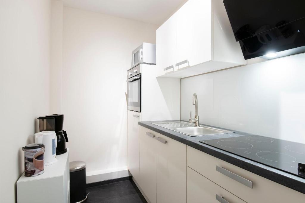 Kuchyň nebo kuchyňský kout v ubytování Baltic Wohnung 143
