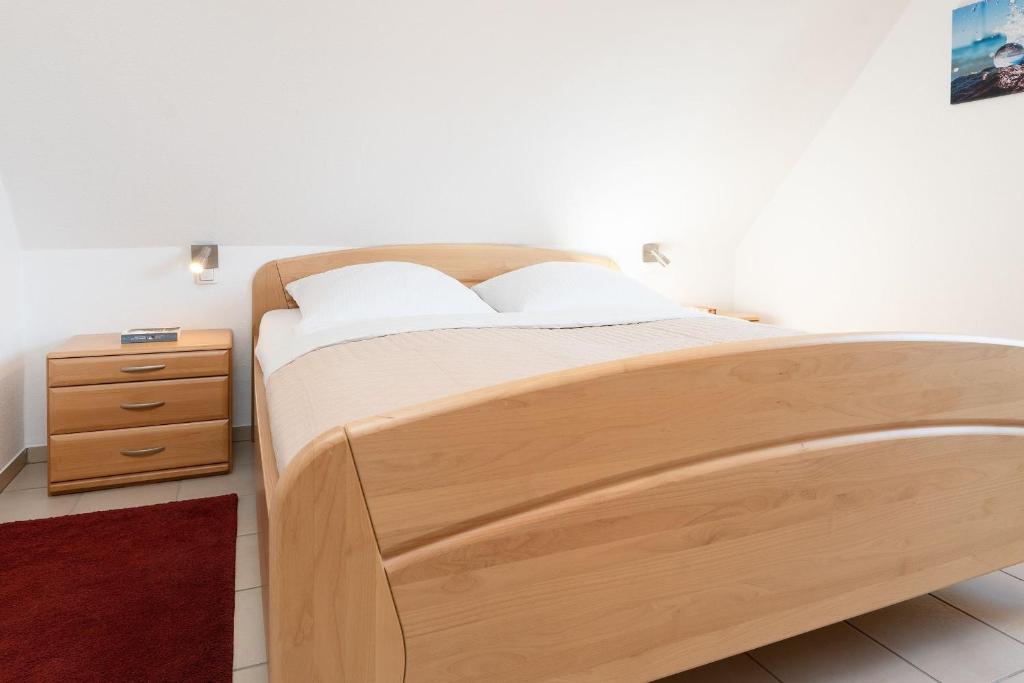 Postel nebo postele na pokoji v ubytování Hasenkamp 18 Hummer