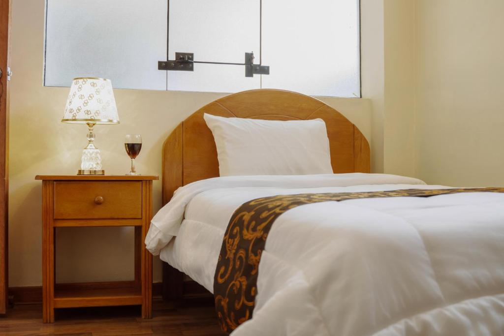 Postel nebo postele na pokoji v ubytování Hotel Casa Shami