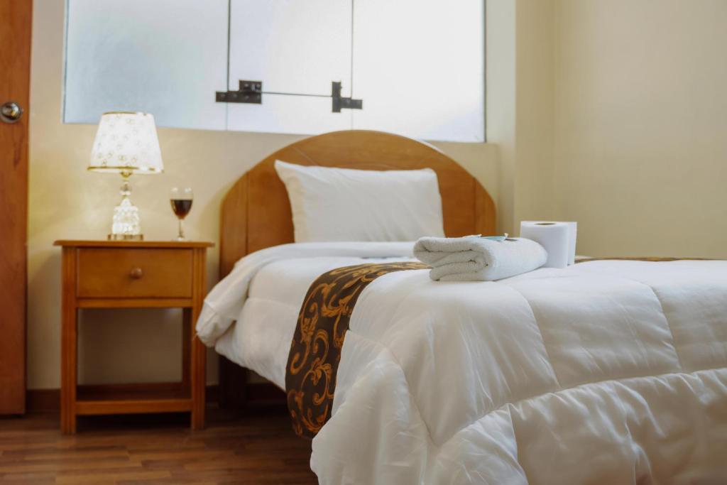 Postel nebo postele na pokoji v ubytování Hotel Casa Shami
