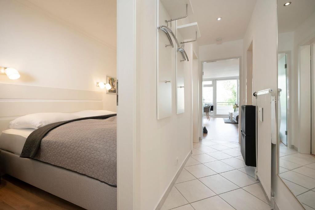 Postel nebo postele na pokoji v ubytování Miramar Wohnung 510
