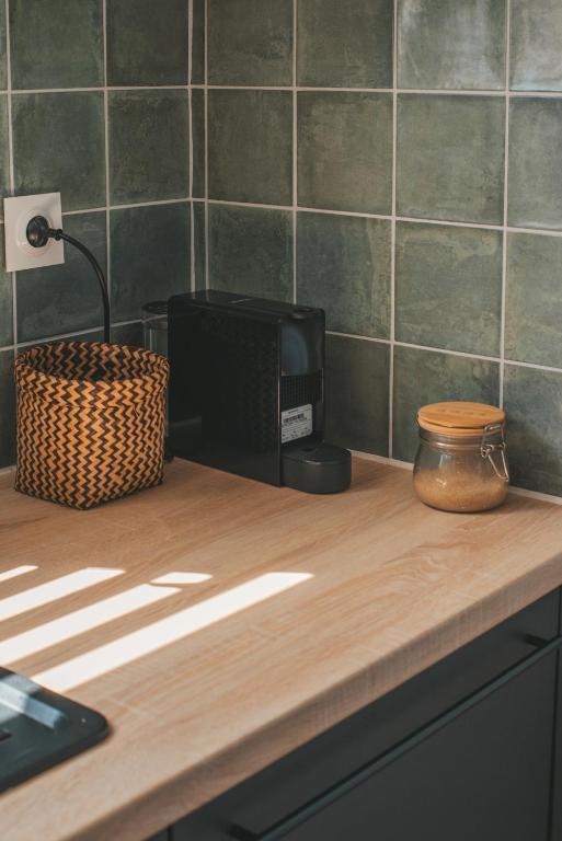 Cuisine ou kitchenette dans l'établissement Le point de vue Studio saint Denis