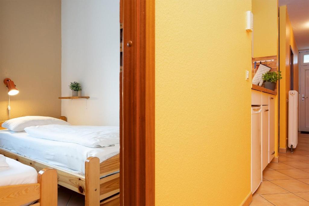 Postel nebo postele na pokoji v ubytování Grömitz Center Seebrückenaussicht