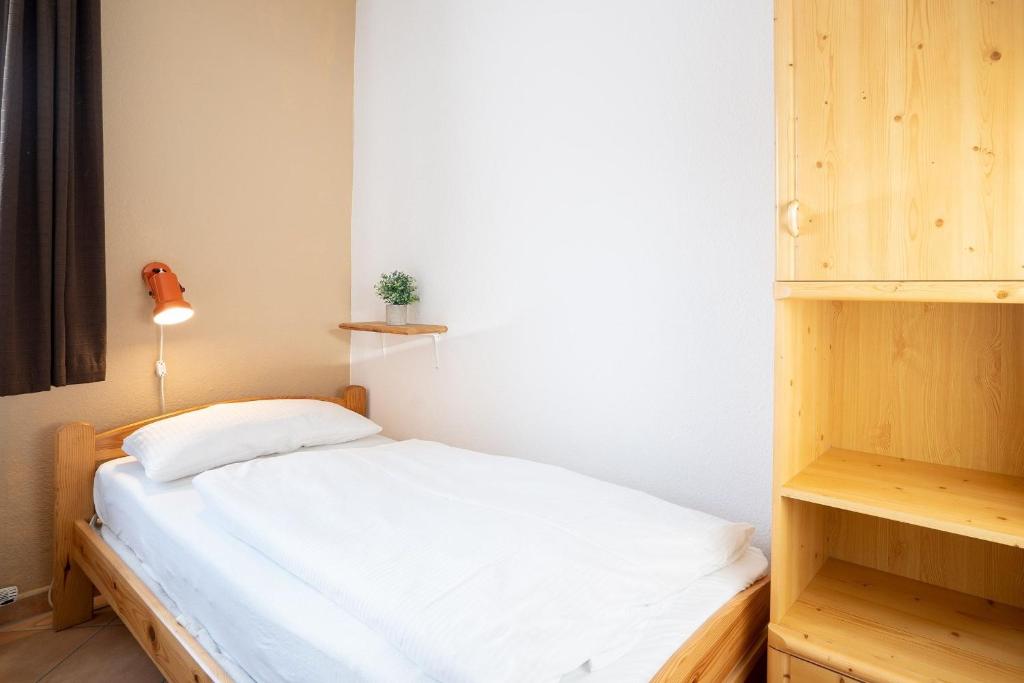 Postel nebo postele na pokoji v ubytování Grömitz Center Seebrückenaussicht