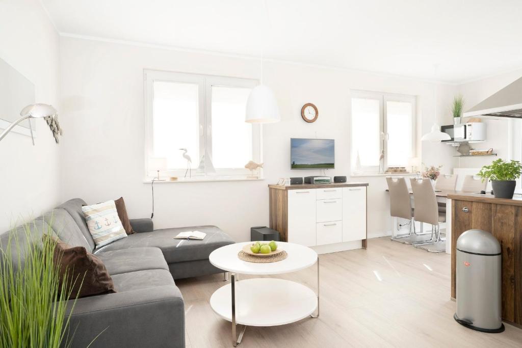 TV a/nebo společenská místnost v ubytování Wohnung 1