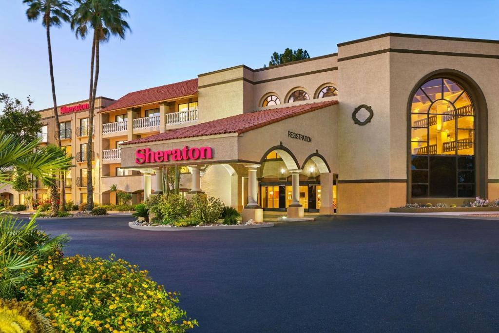 a hotel with a sign for a sheraton at Sheraton Tucson Hotel & Suites in Tucson