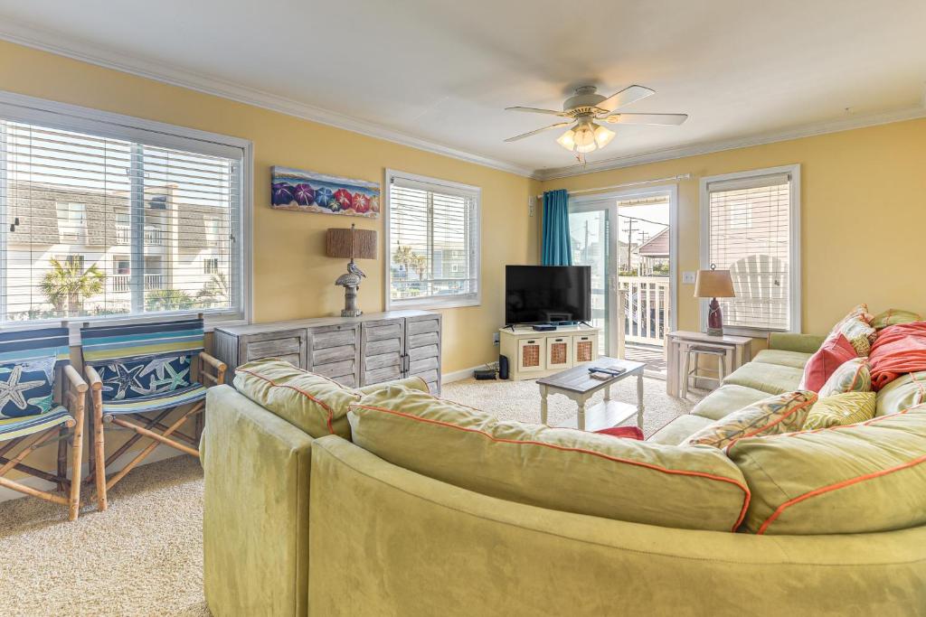 a living room with two couches and a tv at Steps to Beach NMB Condo with Balcony and Pool Access in Myrtle Beach