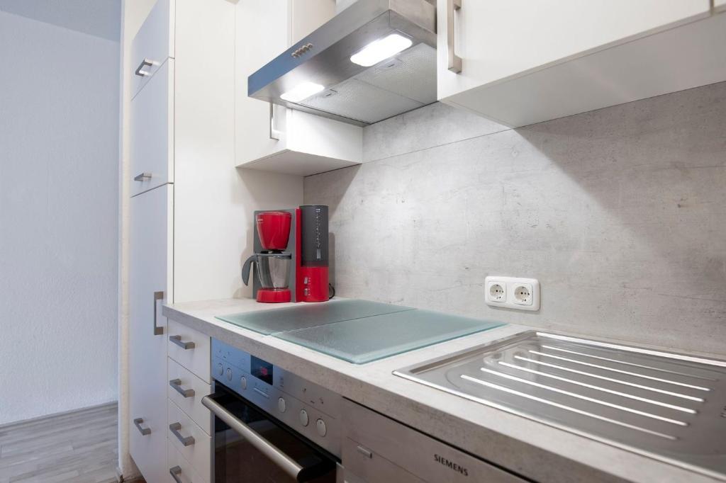 Kuchyň nebo kuchyňský kout v ubytování Strandhotel Kellenhusen Wohnung 3