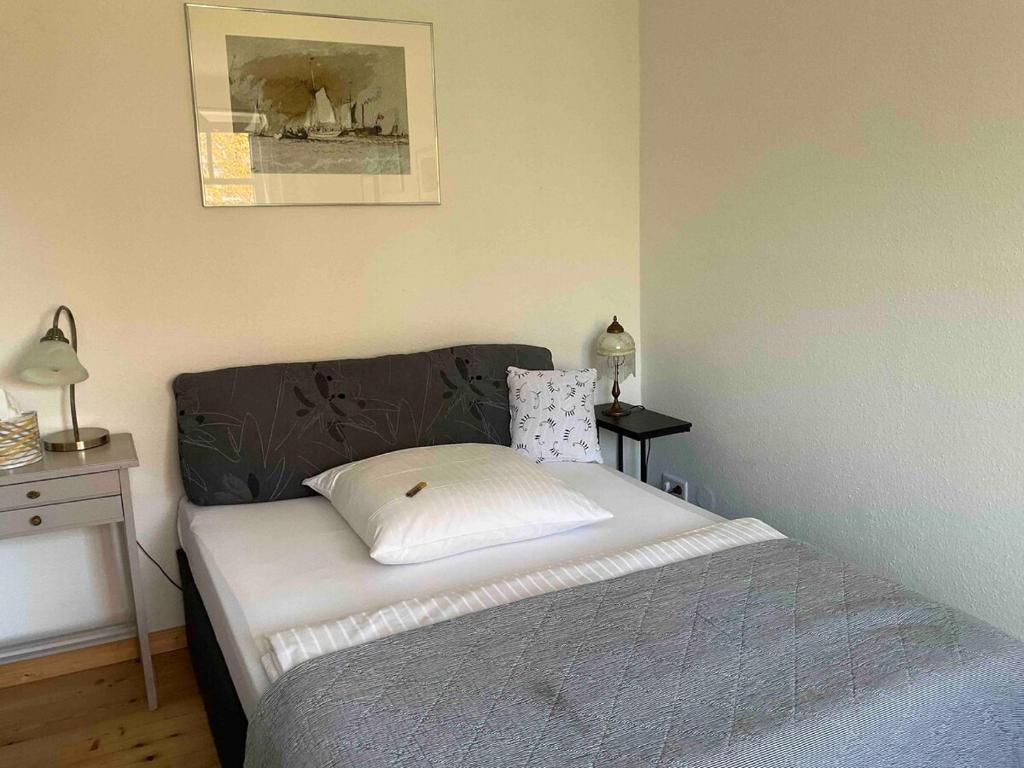 Postel nebo postele na pokoji v ubytování Das Blaue Haus