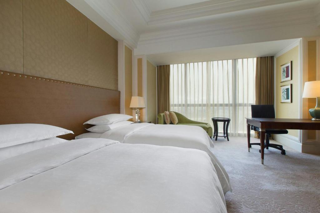 Postel nebo postele na pokoji v ubytování Sheraton Fuzhou Hotel