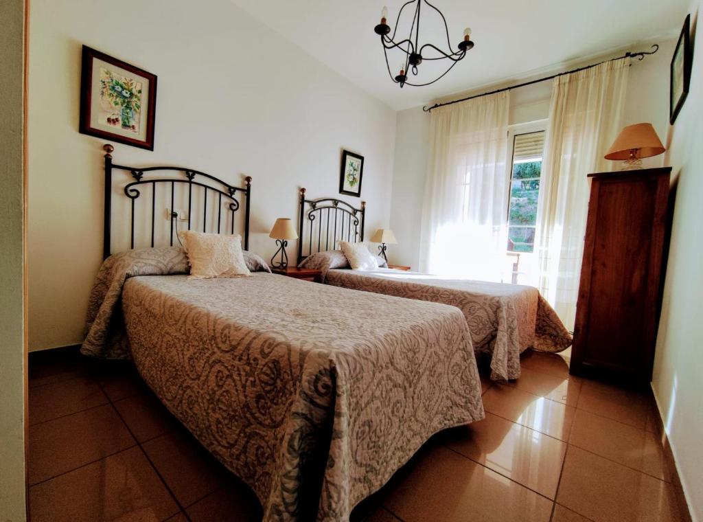 En eller flere senge i et værelse på Burriana Playa