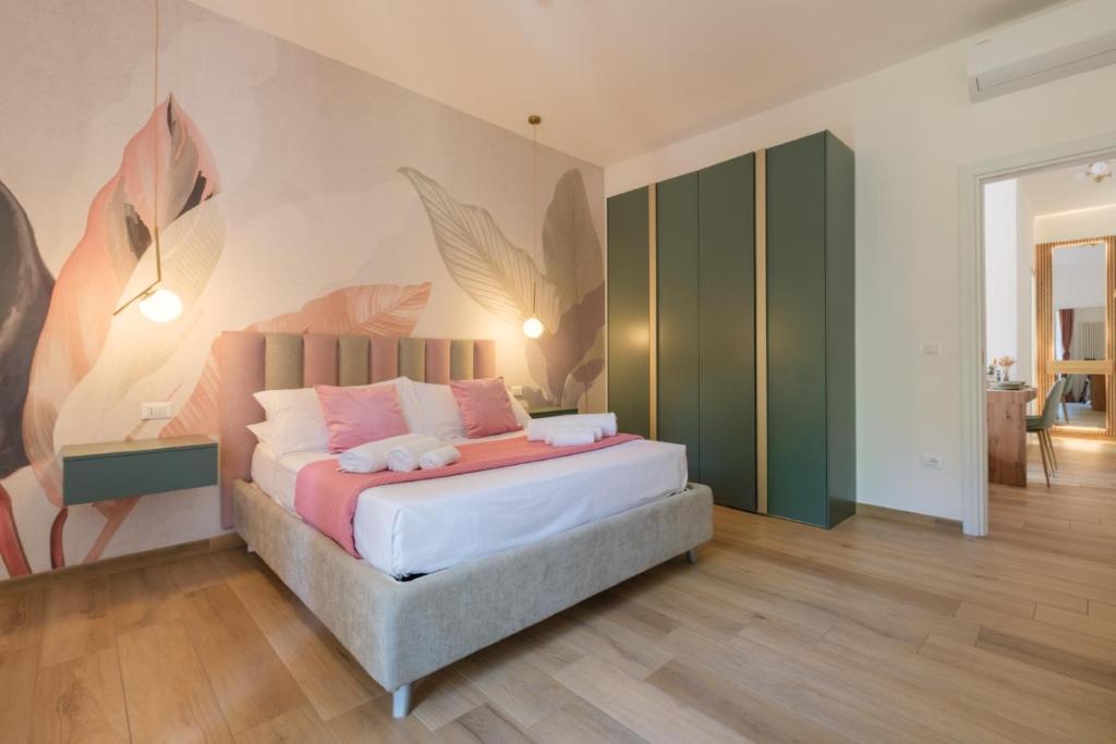 Postel nebo postele na pokoji v ubytování Sant'Orsola Lodge Bologna