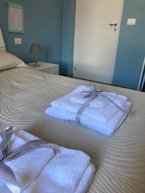 Postel nebo postele na pokoji v ubytování Oltre il Blu
