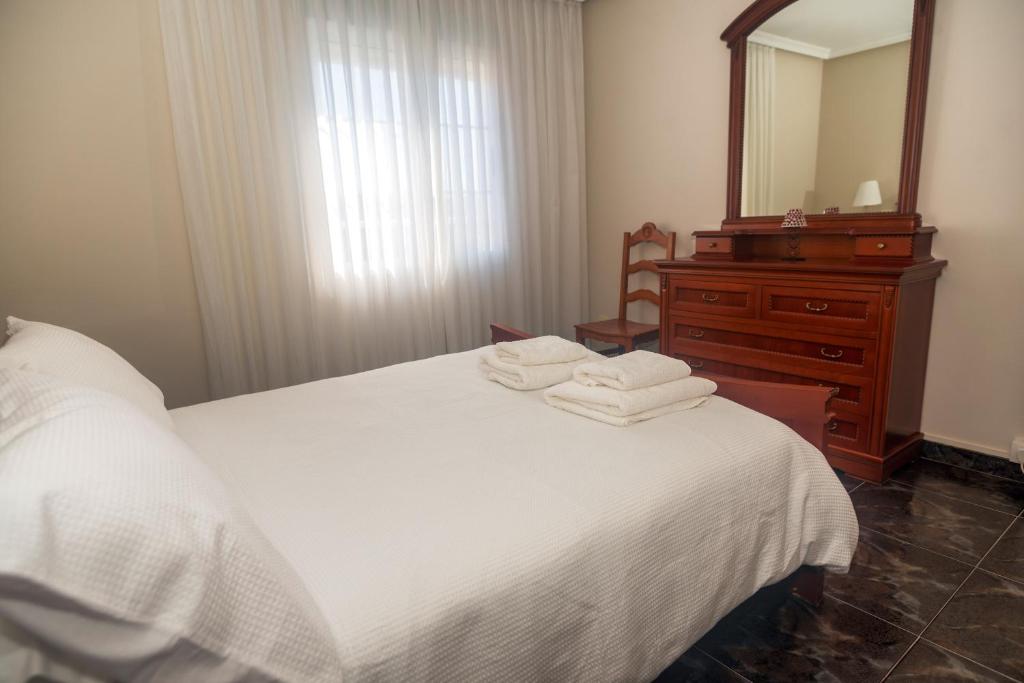 Postel nebo postele na pokoji v ubytování DUPLEX familias