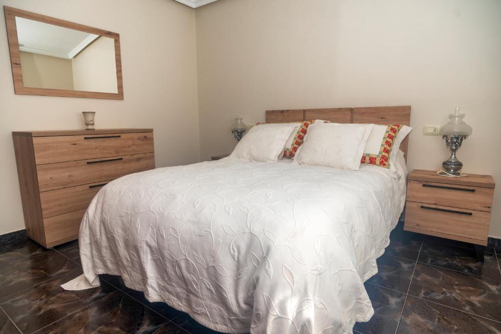 Postel nebo postele na pokoji v ubytování DUPLEX familias