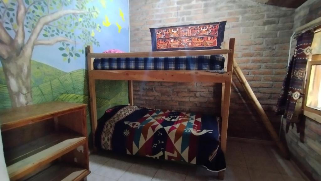 Postel nebo postele na pokoji v ubytování El Tio Hostal