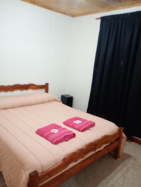 Postel nebo postele na pokoji v ubytování Hospedaje Oscar