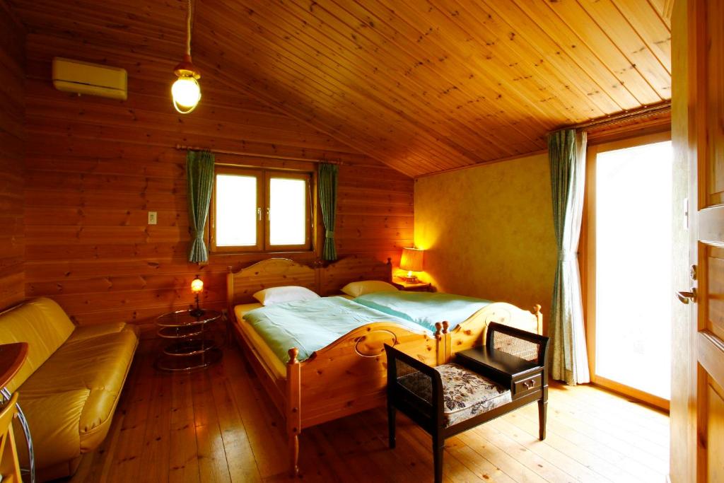 Postel nebo postele na pokoji v ubytování Hotel Andermatt