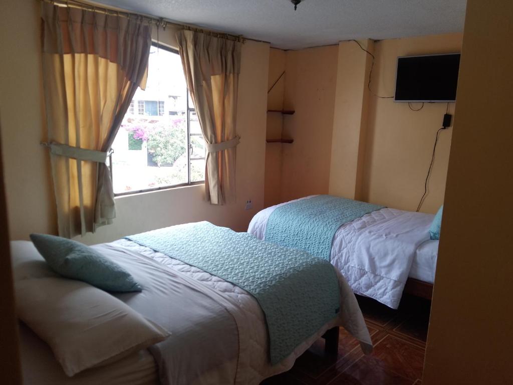 Postel nebo postele na pokoji v ubytování Hotel Amazonia y sol