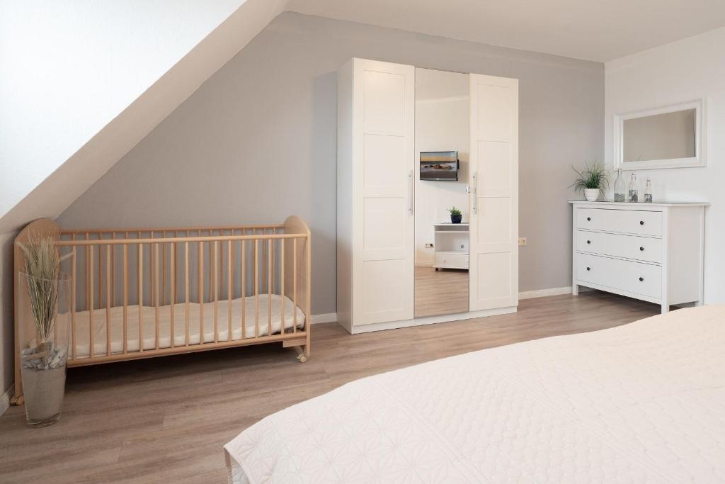 Postel nebo postele na pokoji v ubytování Haus Hasenkamp 26 Hasenbau