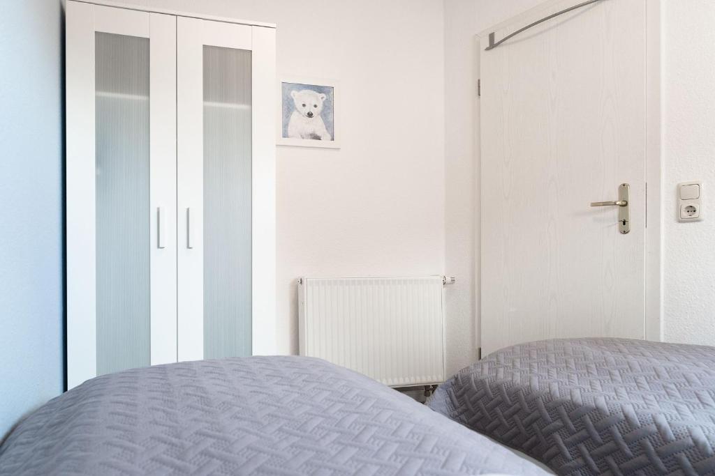 Postel nebo postele na pokoji v ubytování Haus Hasenkamp 26 Hasenbau