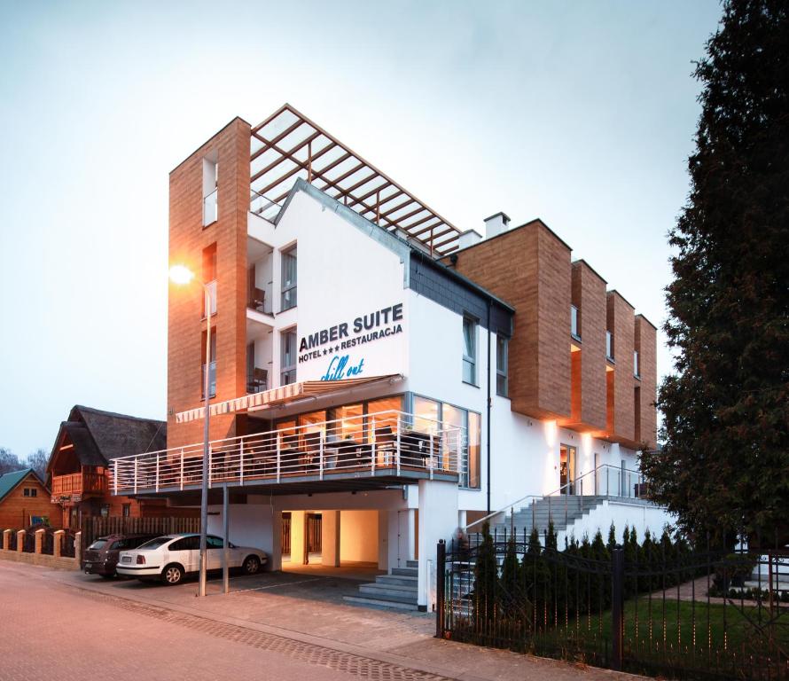 a building with a sign for a music studio at Hotel Amber Suite Enklawa dla Dorosłych in Międzywodzie