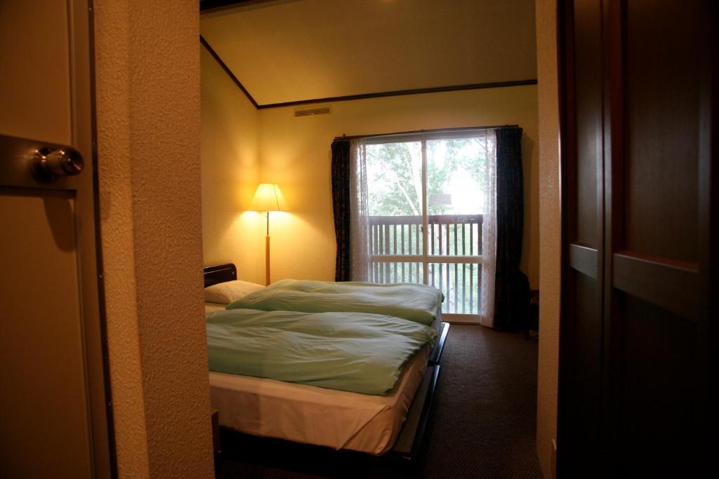 Postel nebo postele na pokoji v ubytování Hotel Andermatt