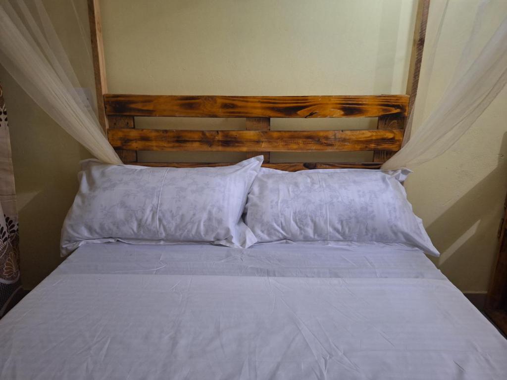 Letto o letti in una camera di Mount Zion Guest House, Mtwapa Mtomondoni
