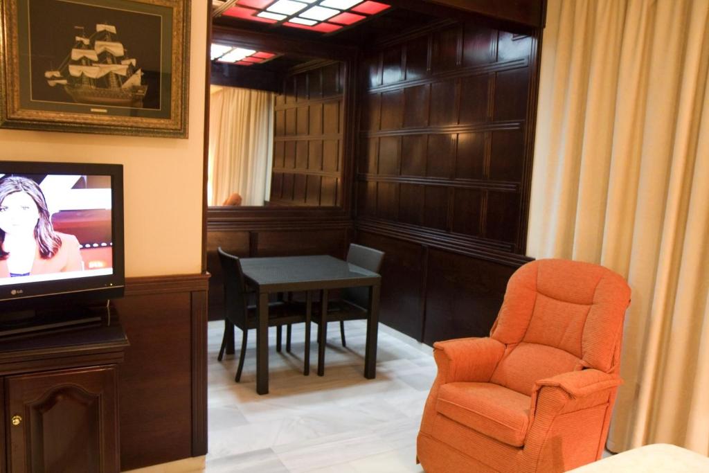 TV a/nebo společenská místnost v ubytování Hotel Las Acacias