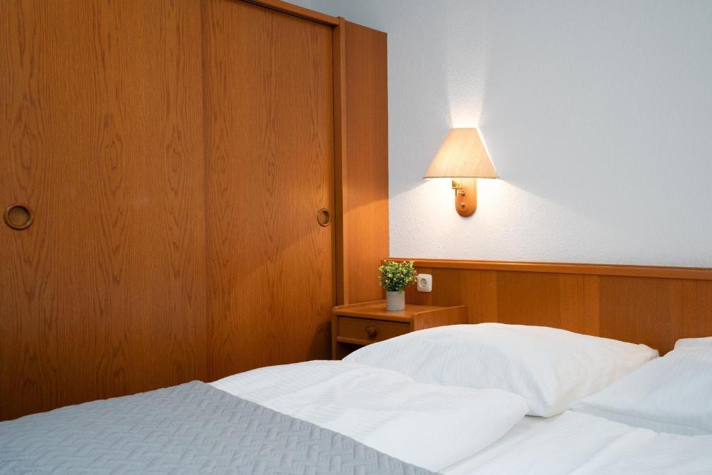 Postel nebo postele na pokoji v ubytování Strandresidenz Wohnung 1