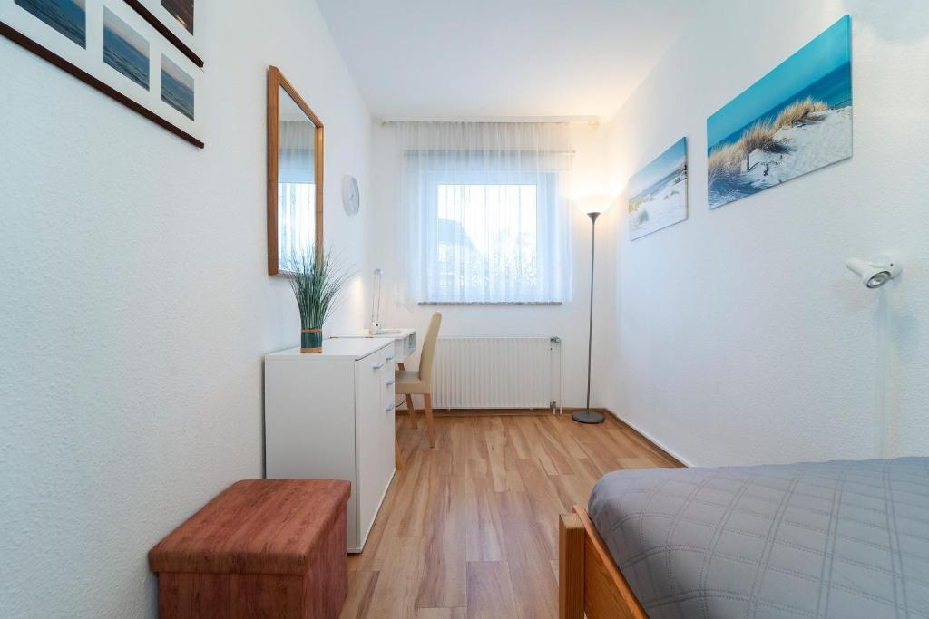 Postel nebo postele na pokoji v ubytování Fischerstraße 10a Zum Möwennest